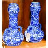 PAir of Italian Majolica twin handled vases decorated in blue & white - measures 33cm tall