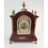 Georgian style mahogany bracket clock in ornate arched case with gilt metal appliques and fast and