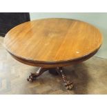 Early Victorian mahogany extending dining table on single heavy pillar base with four large paw