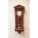 Edwardian Vienna style striking wall clock in oak and glazed case