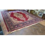 Red and patterned woolpile Persian design carpet 13' x 10'