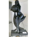 Black resin figure of an art deco seated lady