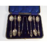 4 floral designed spoons and matching sugar nips,