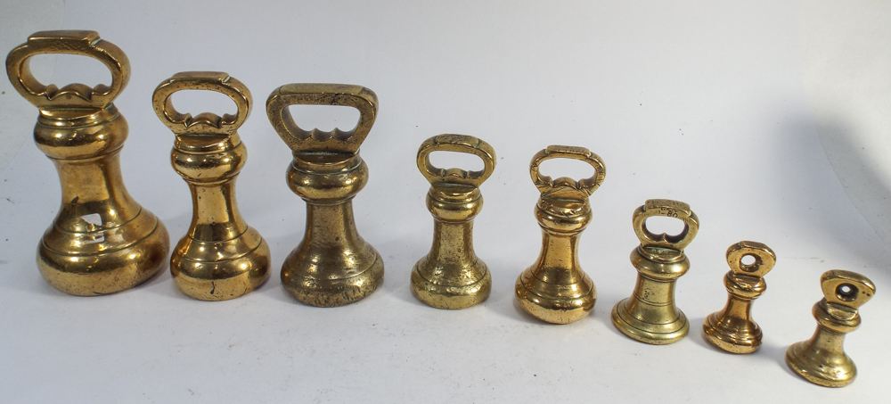 Collection of 8 brass bell weights