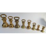 Collection of 8 brass bell weights