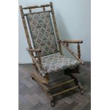 American style turned oak rocking chair with tapestry upholstery