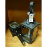 Old black and glass metal lantern and a black painted carriage lamp