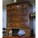 Small reproduction mahogany bow front chest of 4 drawers