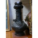 19th century oriental bronze lamp base or vase decorated with dragons, insects etc.