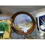 Circular painted porcelain plaque in wooden frame of Lock Oich