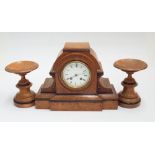 Striking oak cased 3 piece clock garniture