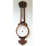 Edwardian banjo wall barometer in an oak case