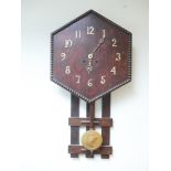 Hexagonal oak wall clock with striking movement