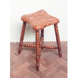 Carved oak stool on bobbin turned legs with cross stretchers