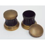 Pair of brass and black capstan shaped cigarette holders