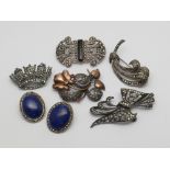 Five silver and marcasite brooches and a pair of oval lapis and marcasite ear clips.