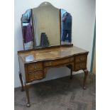 1950s walnut kneehole dressing table standing on cabriole legs with triple mirrors,