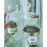 Various dressing table jars and a miniature oil lamp
