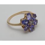 10k yellow gold tanzanite and diamond flower design cluster ring,