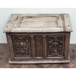 Victorian stripped carved oak blanket chest with decorative figure mounted front panels