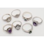 A collection of seven silver stone set dress rings.