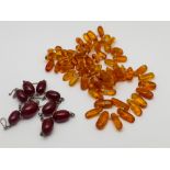 Row of Baltic amber elongated beads with screw fastening,