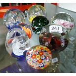 8 various coloured glass paperweights