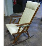 Mahogany framed cream leather upholstered lounger type chair