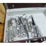 Various matching kings patterned cutlery in black briefcase