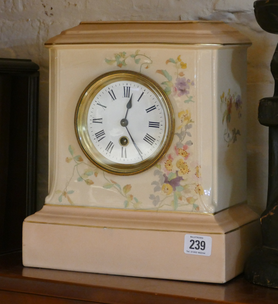 Mantle clock in floral decorated and pale pink china case,