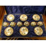 Japanese figure decorated coffee service in fitted case