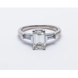 Diamond solitaire ring, set with a trap cut diamond weighing 1.