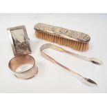 Collection of small silver ware to include Victorian sugar nips, miniature photograph frame,