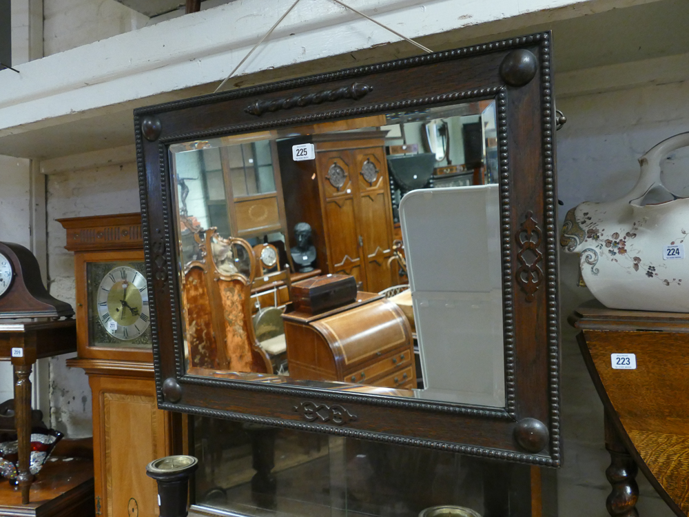 Bevelled wall mirror in Jacobean style beaded oak frame