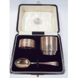 Boxed silver christening set comprising egg cup, spoon and napkin ring Birmingham 1933,