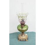 Victorian brass oil lamp with decorative green and gilt glass bowl and floral decorated shade