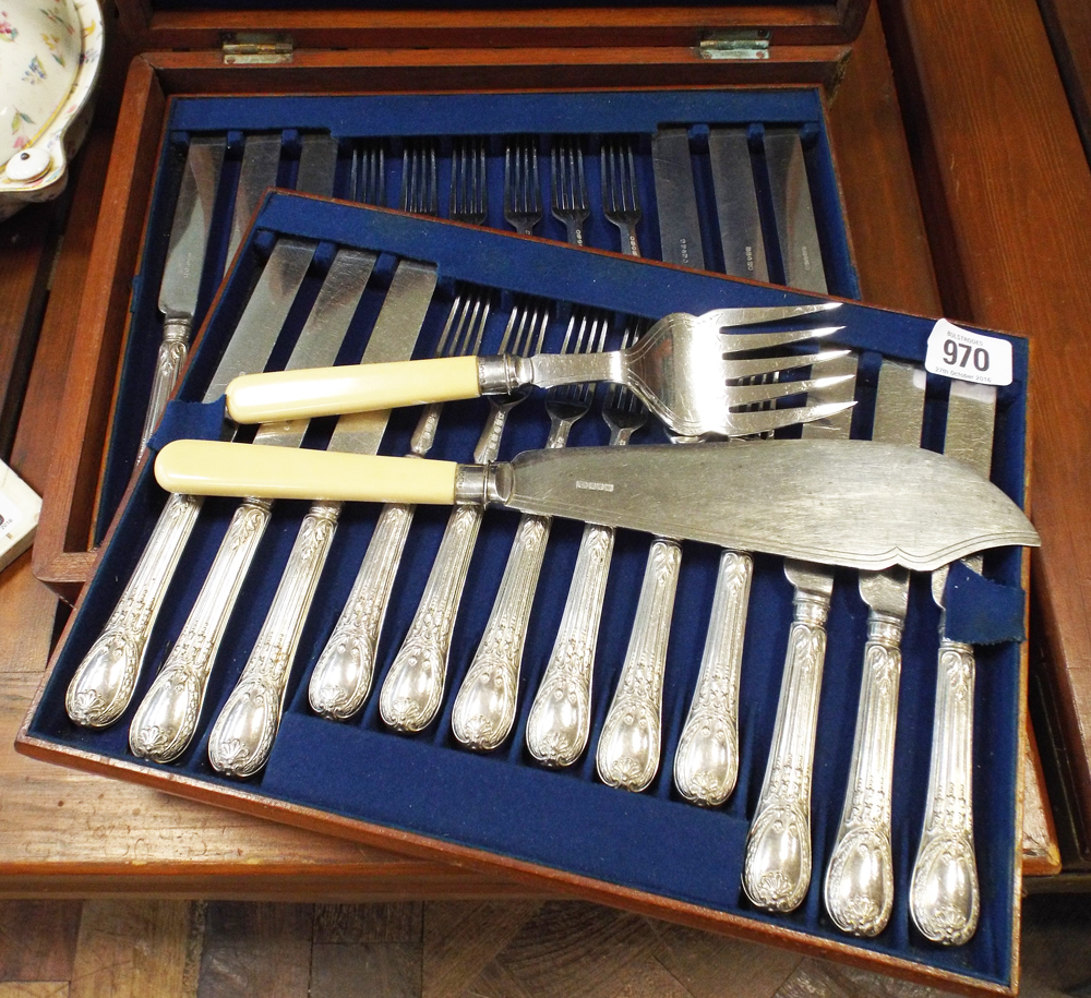 Set of 18 knives and forks in mahogany case and a pair of plated fish servers