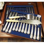 Set of 18 knives and forks in mahogany case and a pair of plated fish servers