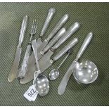 Various silver handled knives, silver teaspoon etc.