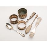 A collection of small silver ware - two napkin rings, salt cellar,