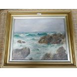 Gilt framed oil painting of a rocky shore scene