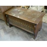 Small reproduction oak blanket chest with linen fold panel front