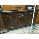 5' Edwardian walnut sideboard with bow front centre section fitted drawers and carved cupboard