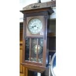 1930's striking wall clock in oak and glazed case