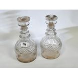 A pair of Georgian hobnail cut decanters with stoppers