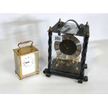 A 400 day Anniversary clock in iron case and a brass cased carriage clock