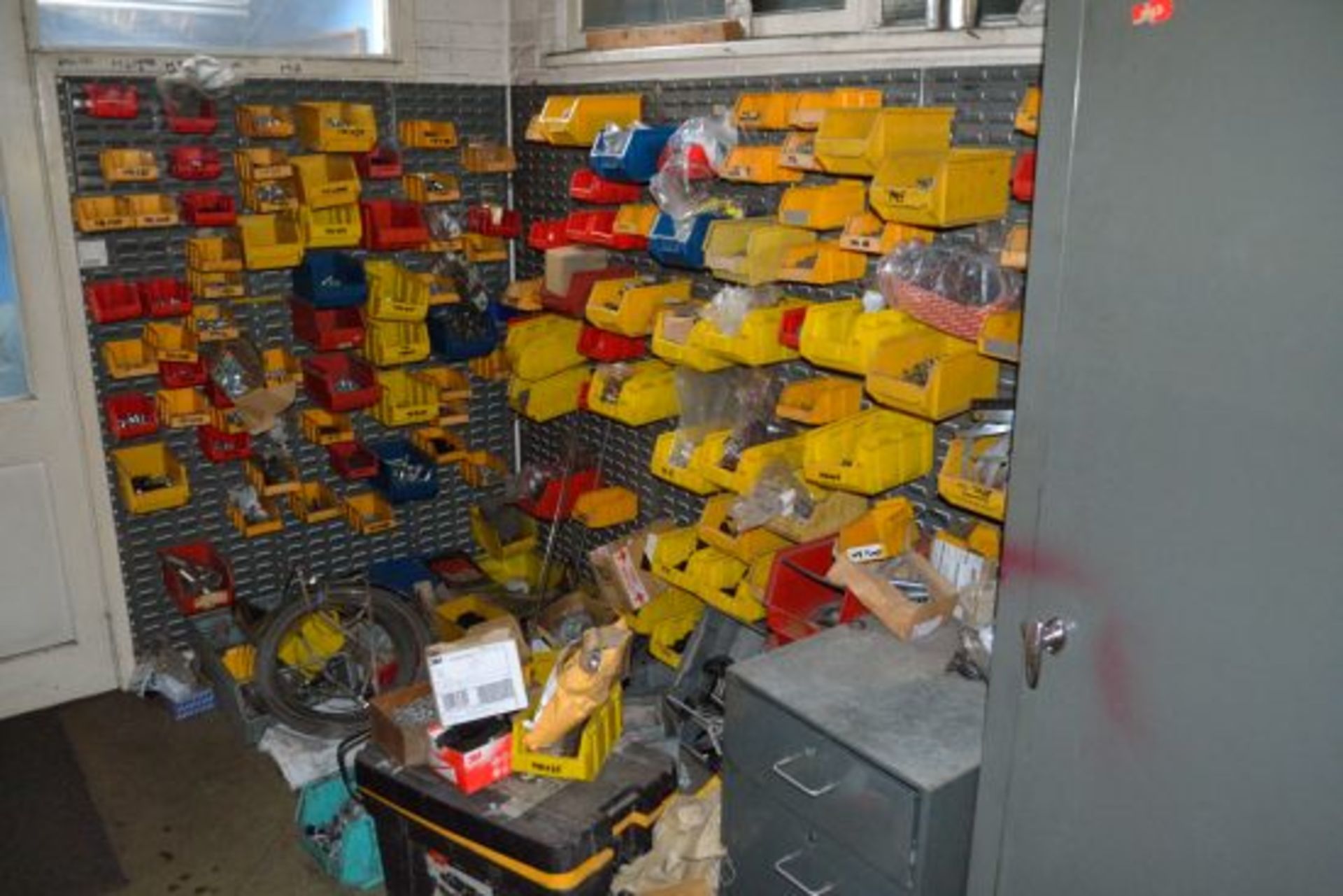 Contents of store room containing various fasteners and tools