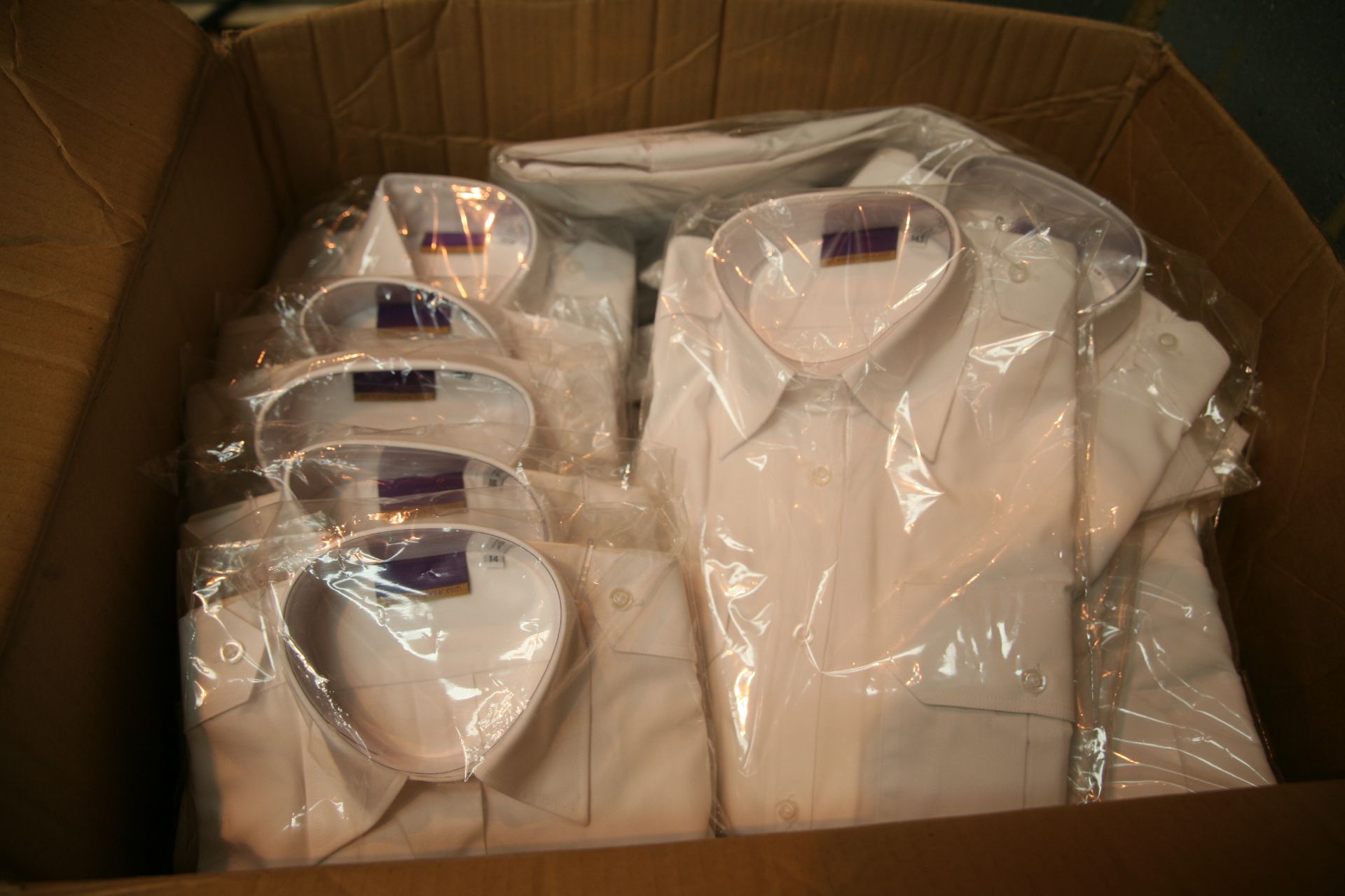 Box Of Various Sized White Shirts