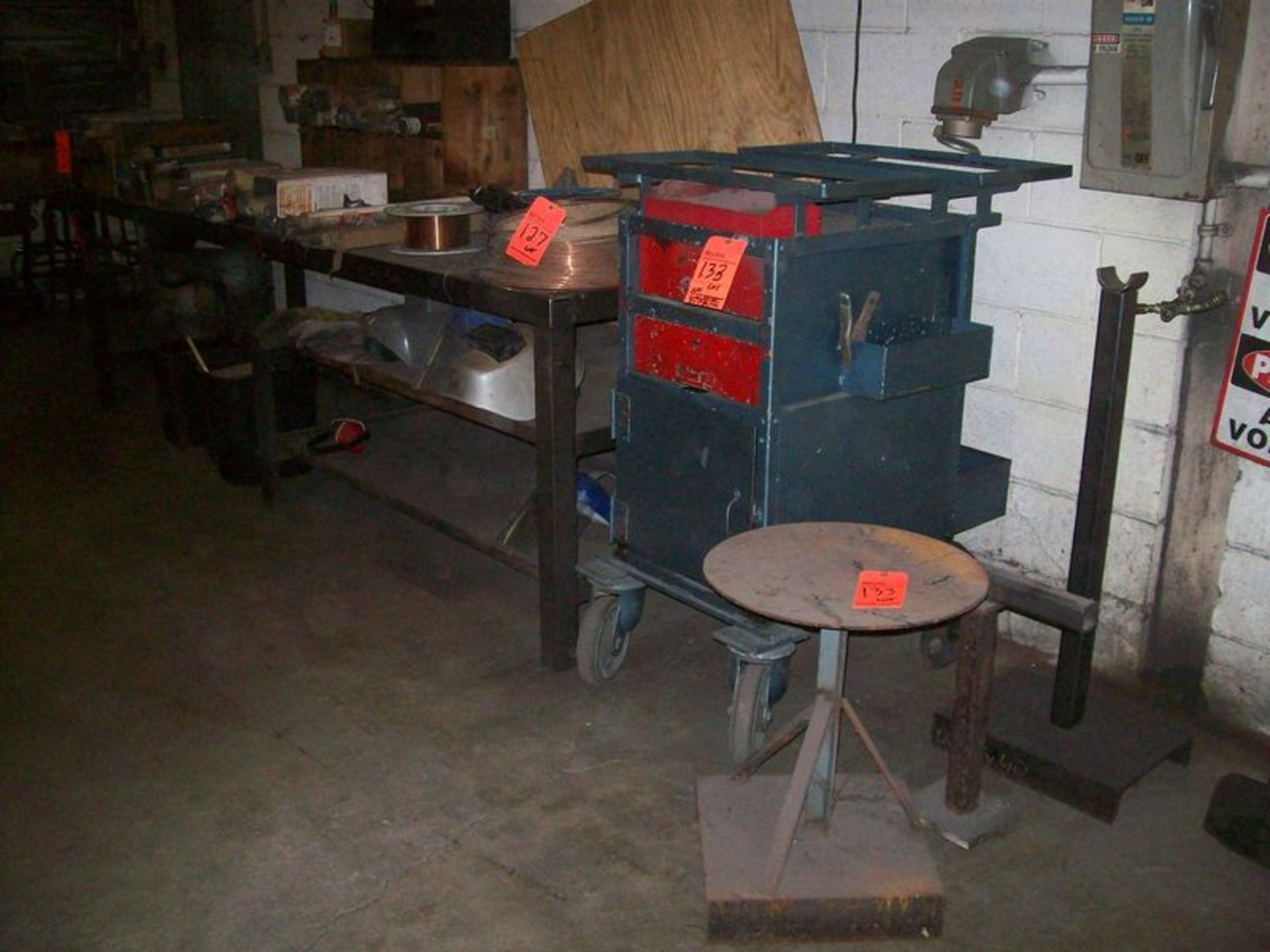 Lot includes (1) steel welding table, 10' X 36" X 34"H, (1) portable tool box, and (2) ass't metal