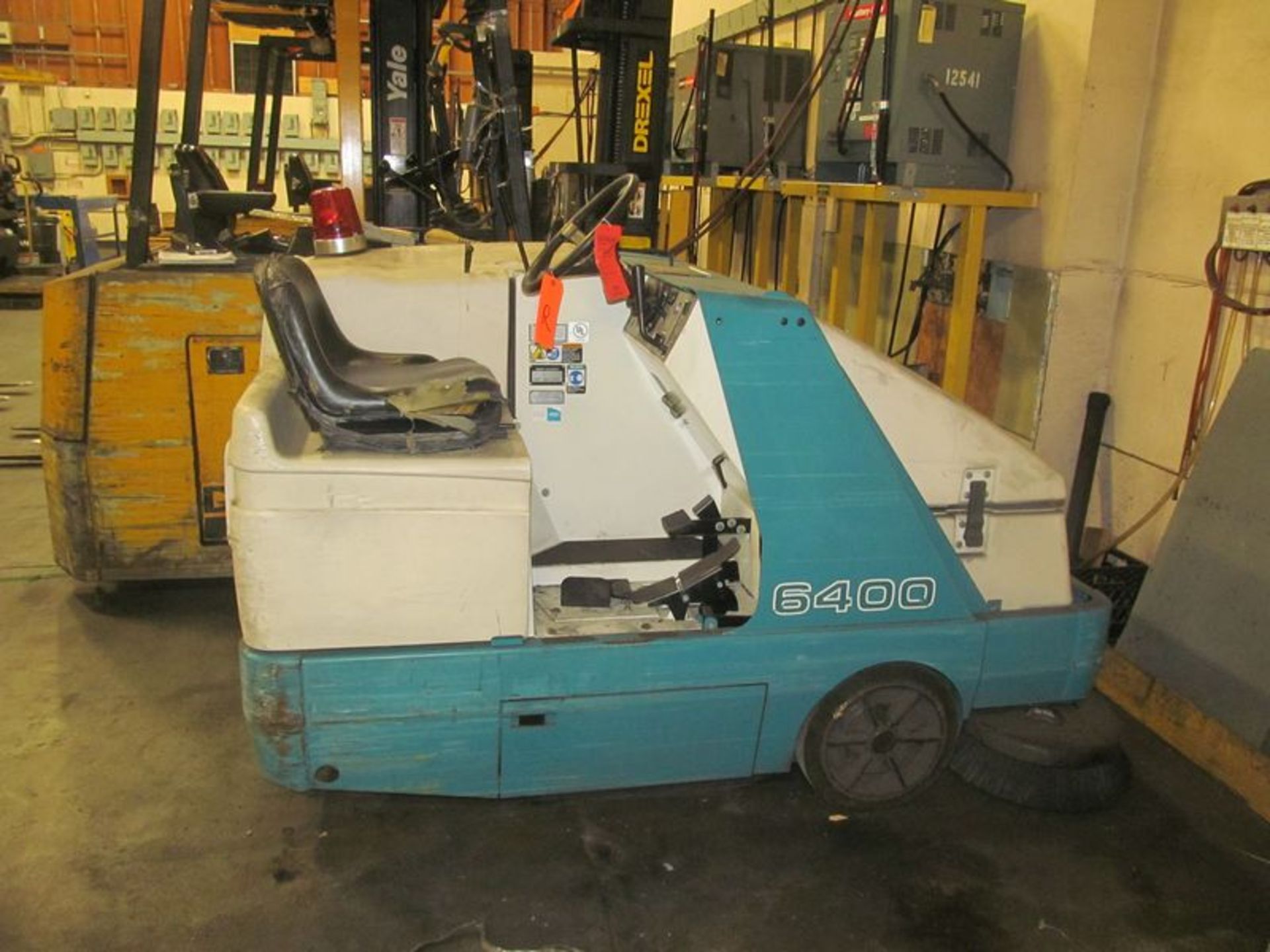 Tennant propane powered floor scrubber/sweeper, 1968 hrs. IN NEED OF REPAIR